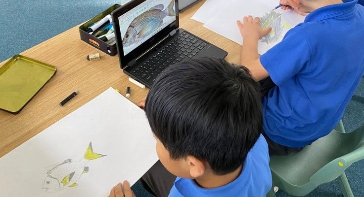 Hillside students using technology to assist with artwork.