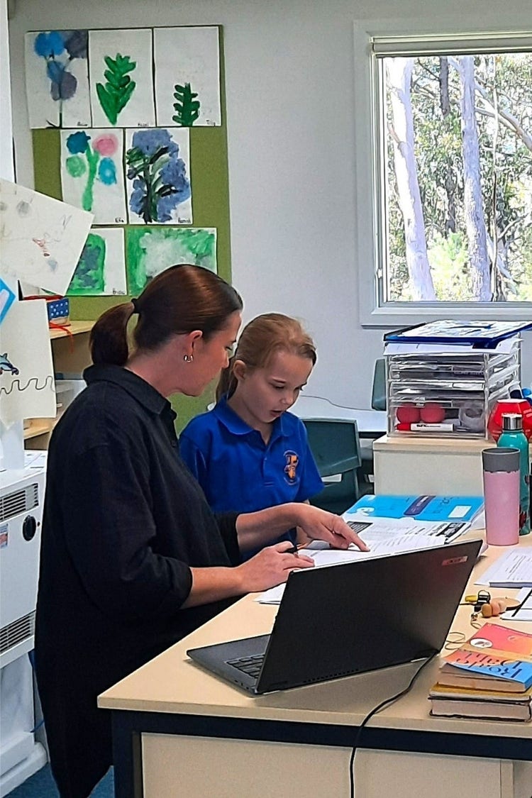 Teacher proving feedback on a Hillside student's work.