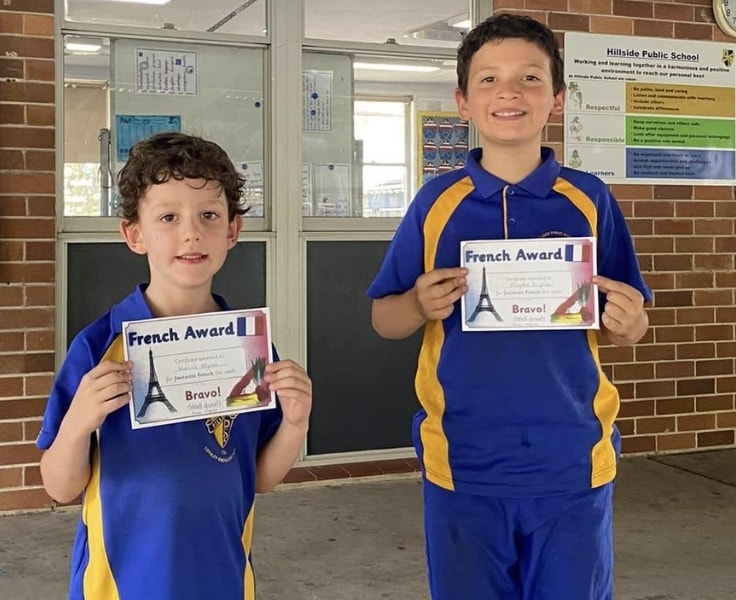 Hillside students holding French award up