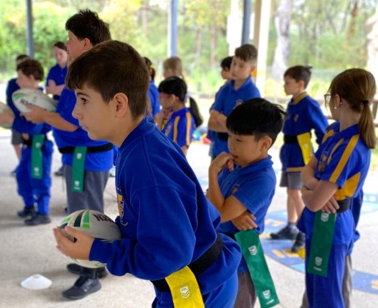 Hillside students training for league tag under the cola.