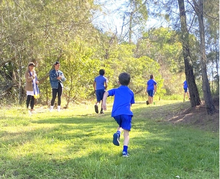 Hillside student running on cross country track at Hillside Public school.